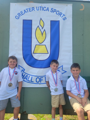 BOYS 7-9 From left to right, first-, second- and third-place finishers: Graham Abbe, Vinny Dare, Rocco Dare.